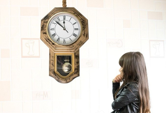 Girl Waiting at Clock